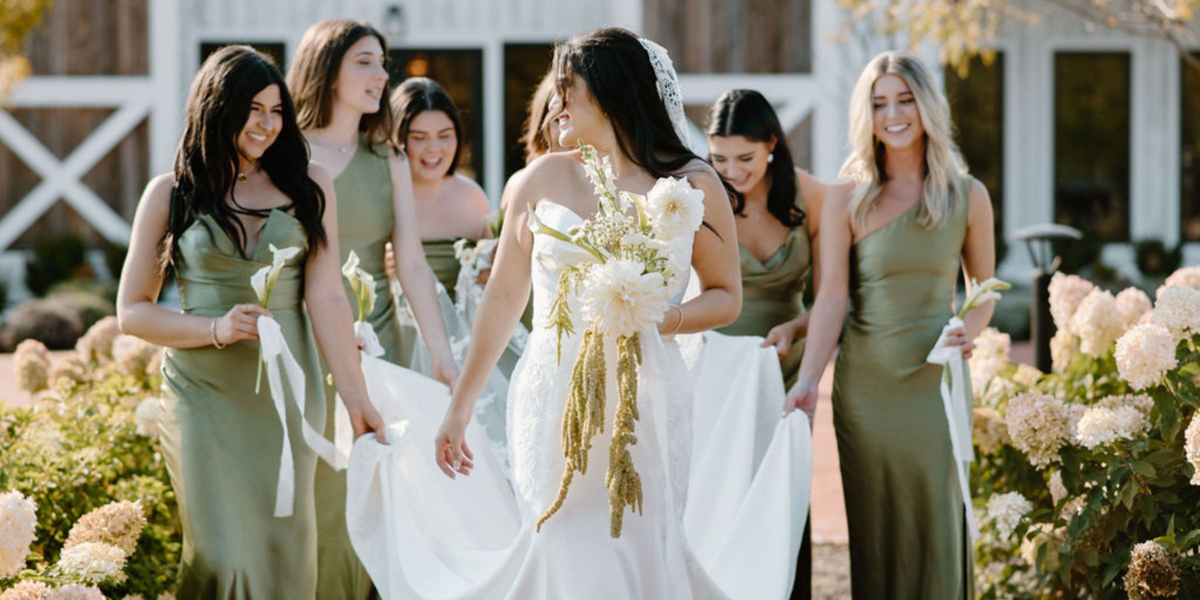 Bride and bridesmaids walk out of Kent Island Resort.