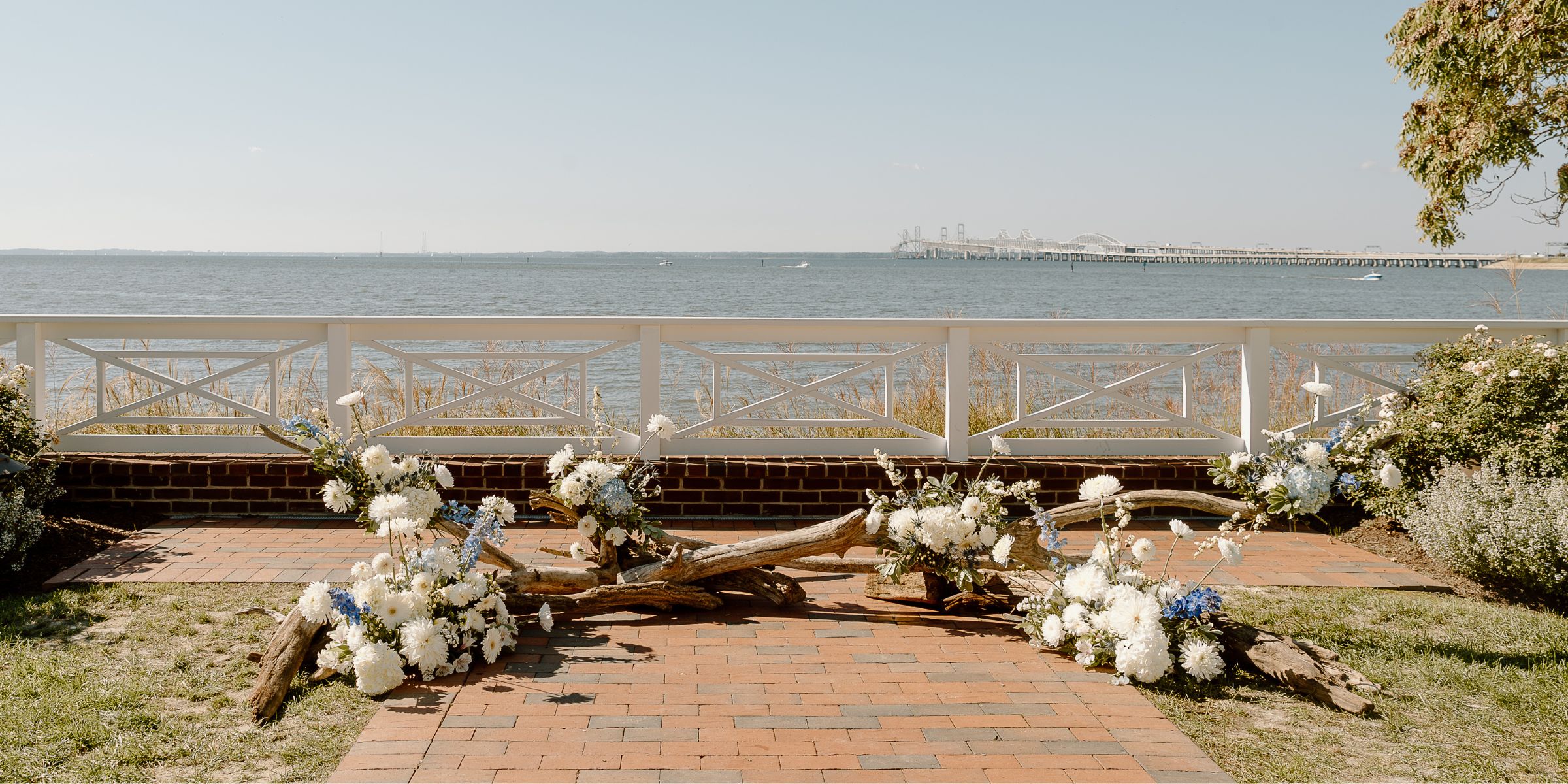 Driftwood ceremony arch with flowers