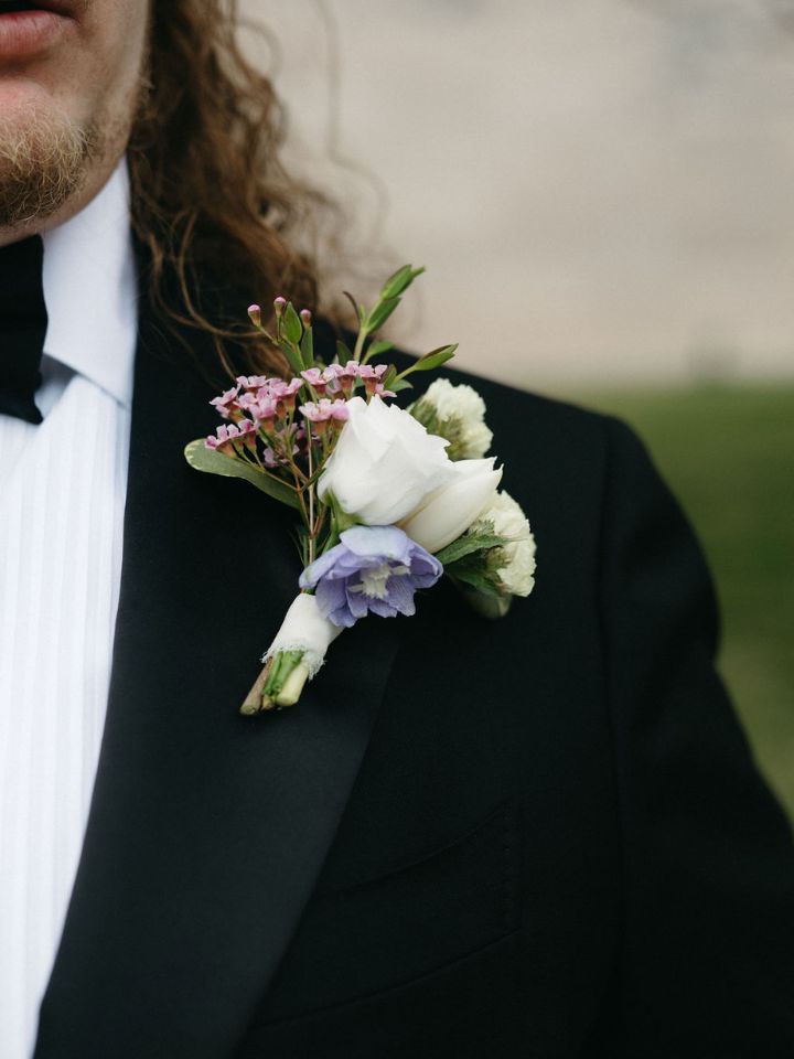 Spring pastel boutonniere on black suit jacket.