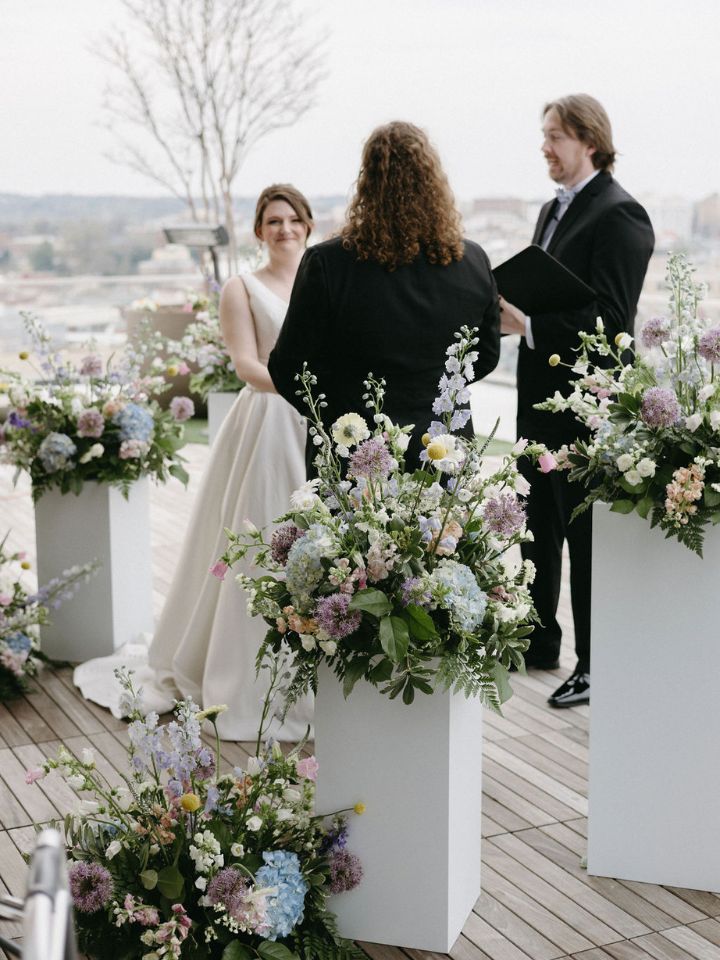Wedding ceremony among mixed height pedestals.