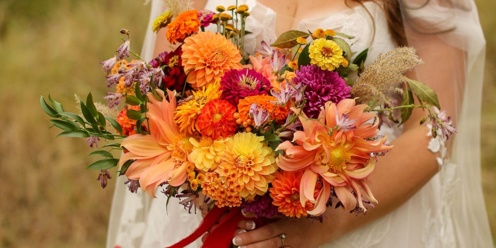 Closeup of bright colored fall bridal bouquet.