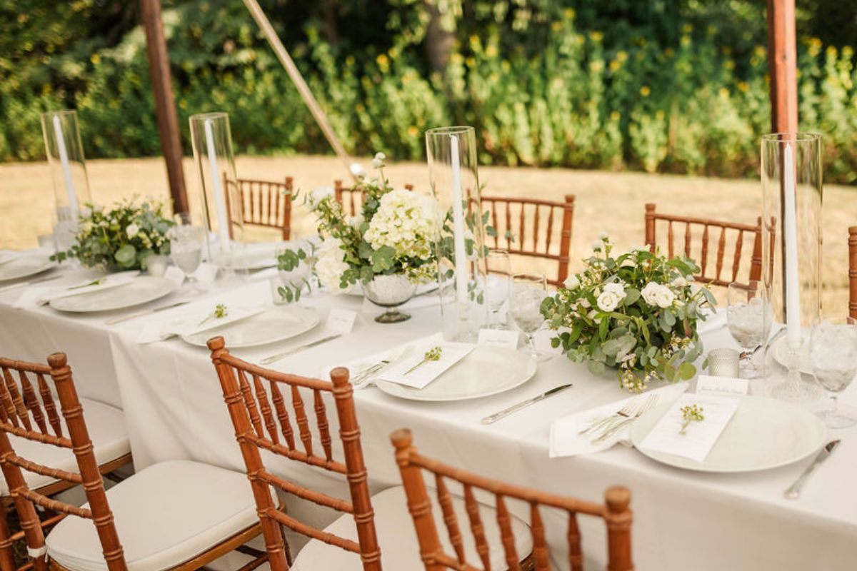 Table centerpieces on a long rectangular table.
