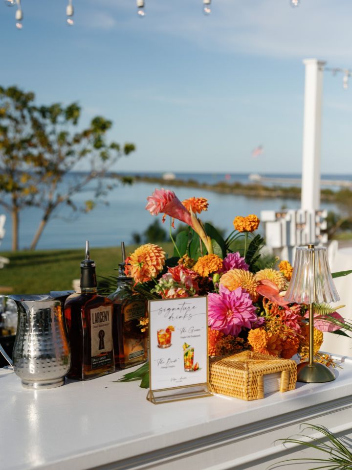 Flower arrangement on bar during cocktail hour.