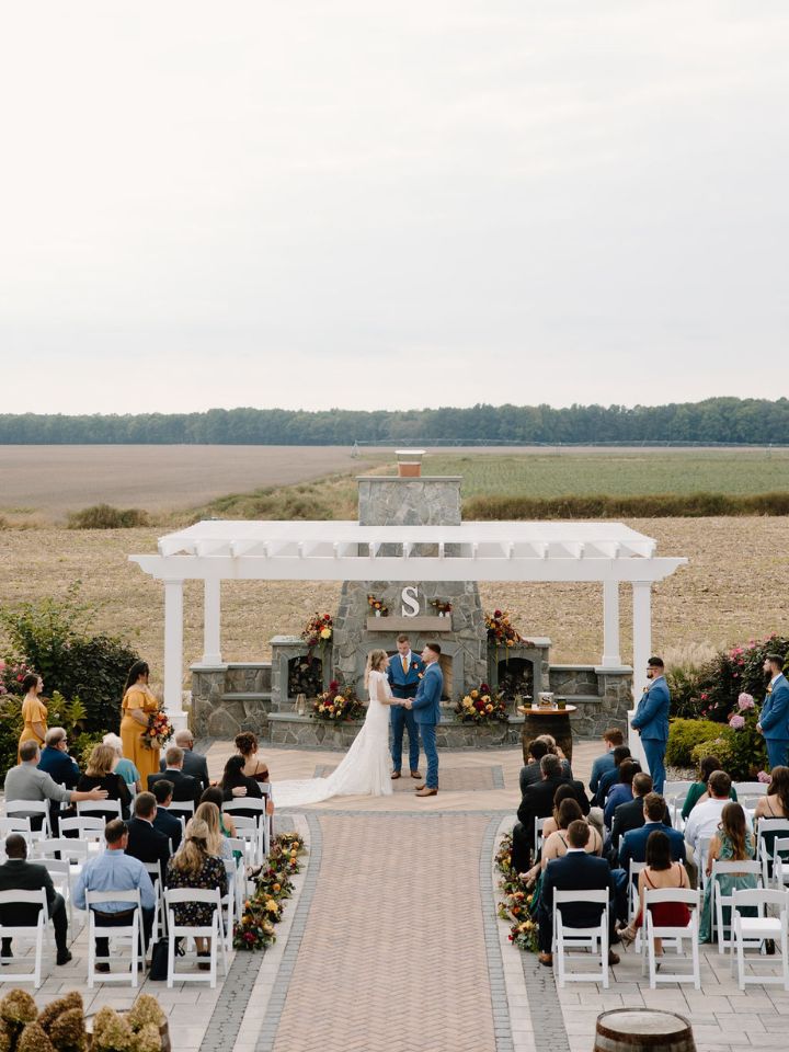 Overhead view of Vanderwende acres fall wedding outside at the stone fireplace.