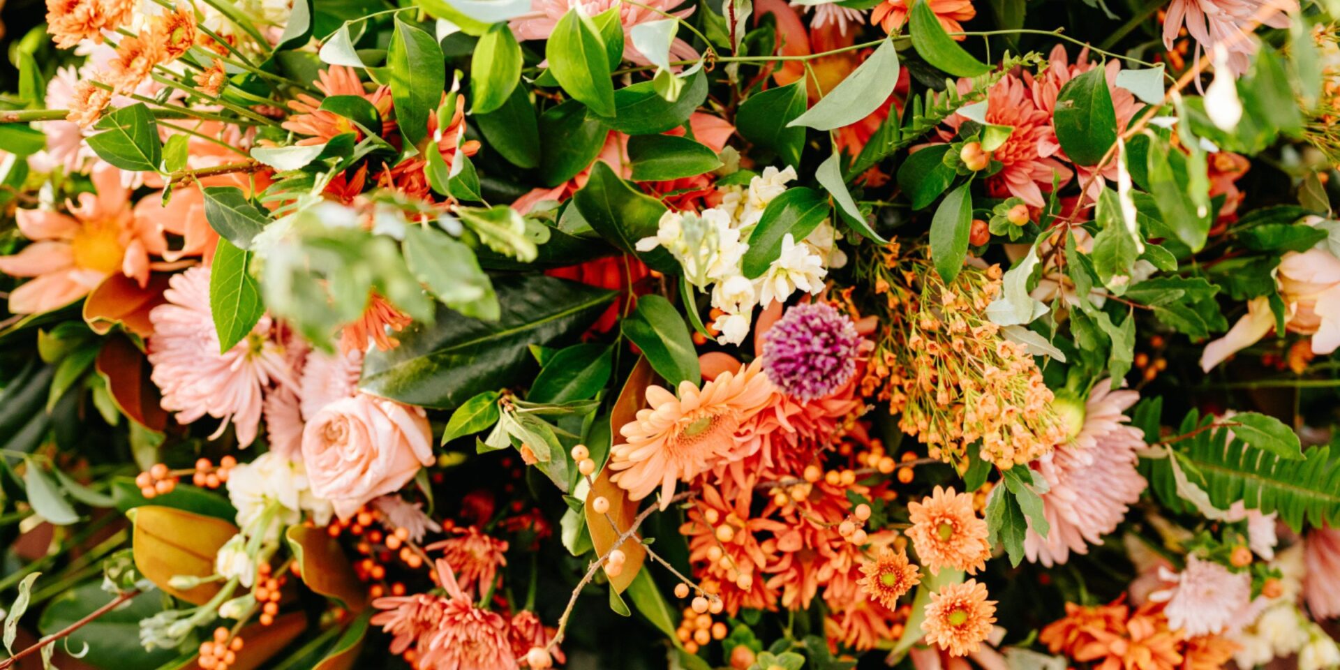 Closeup photo of fall colored flowers for a wedding.