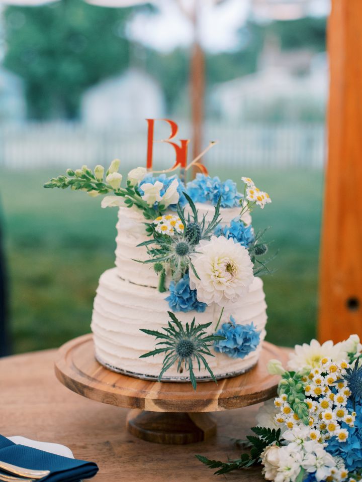 White wedding cake with flowers.