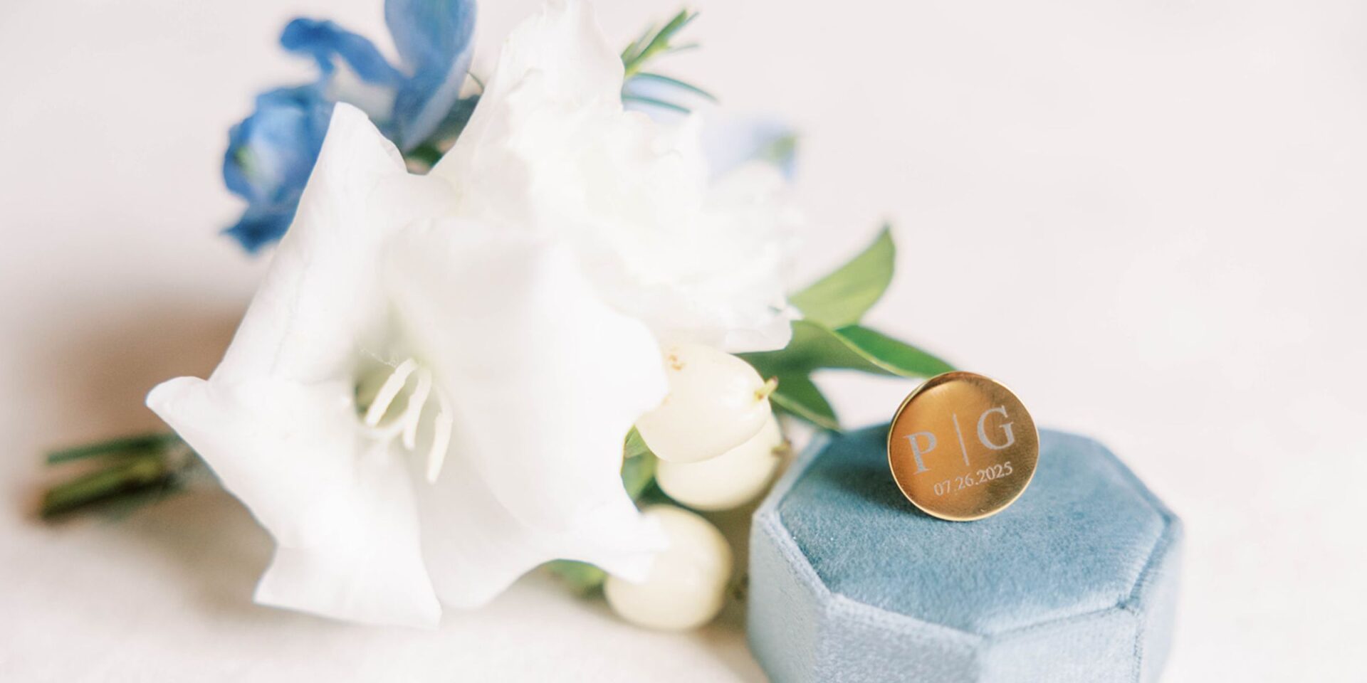 Closeup of boutonniere flowers with cufflink.