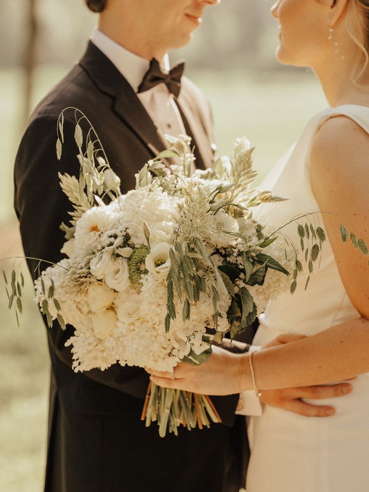 Closeup of bridal bouquet in white garden style.