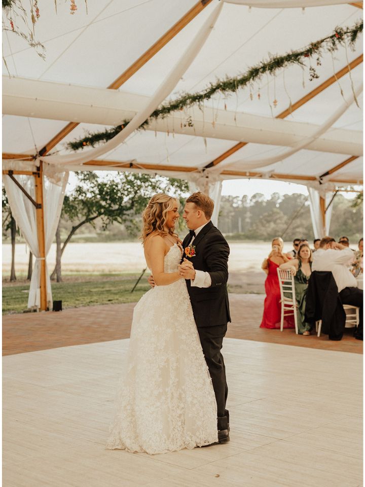 Bride and groom share first dance.