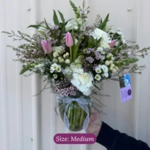 Medium sympathy vase arrangement by Wildly Native Flower Farm in soft colors