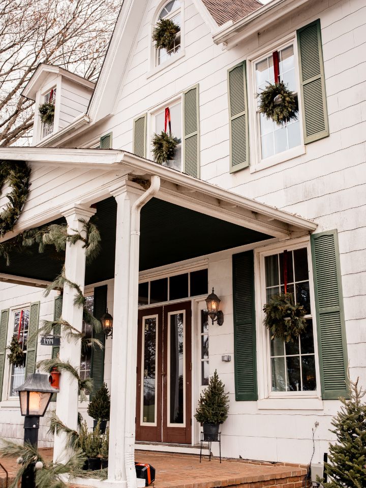 View of winter elopement on an older style farmhouse porch.
