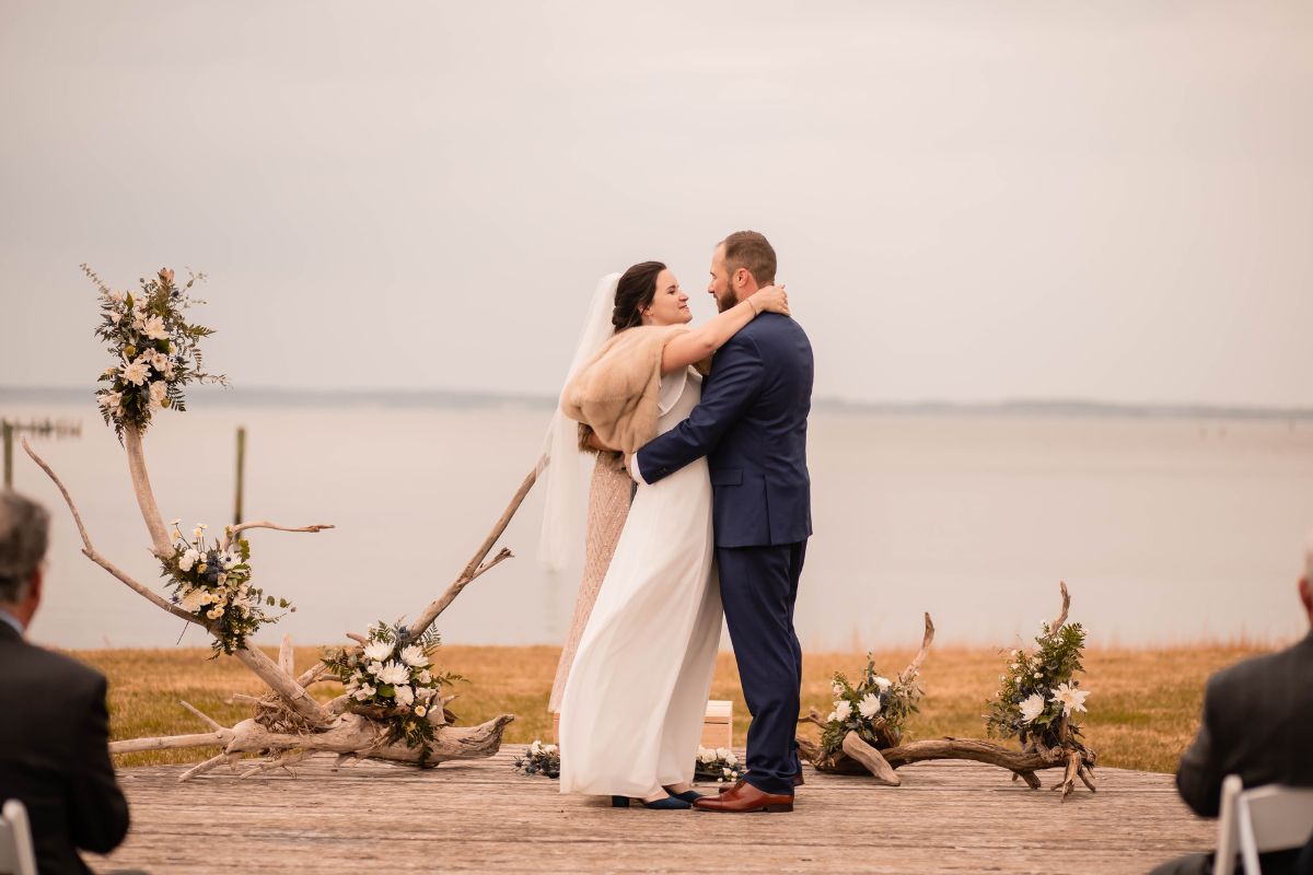 Waterfront winter wedding ceremony at Wylder Hotel TIlghman Island.