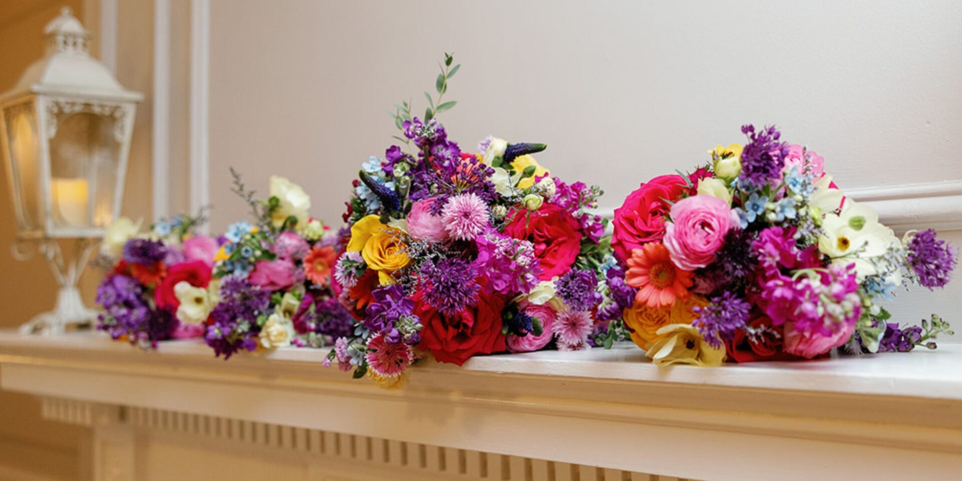 Bright flower bouquets lined up on matel.