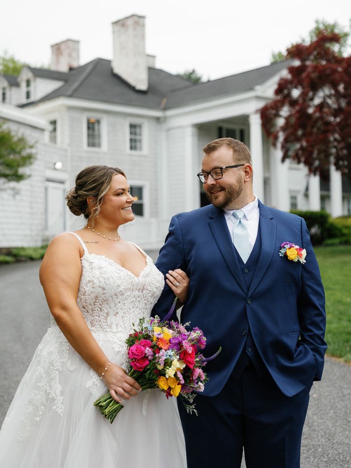 Bride and groom in front of Overhill Mansion.