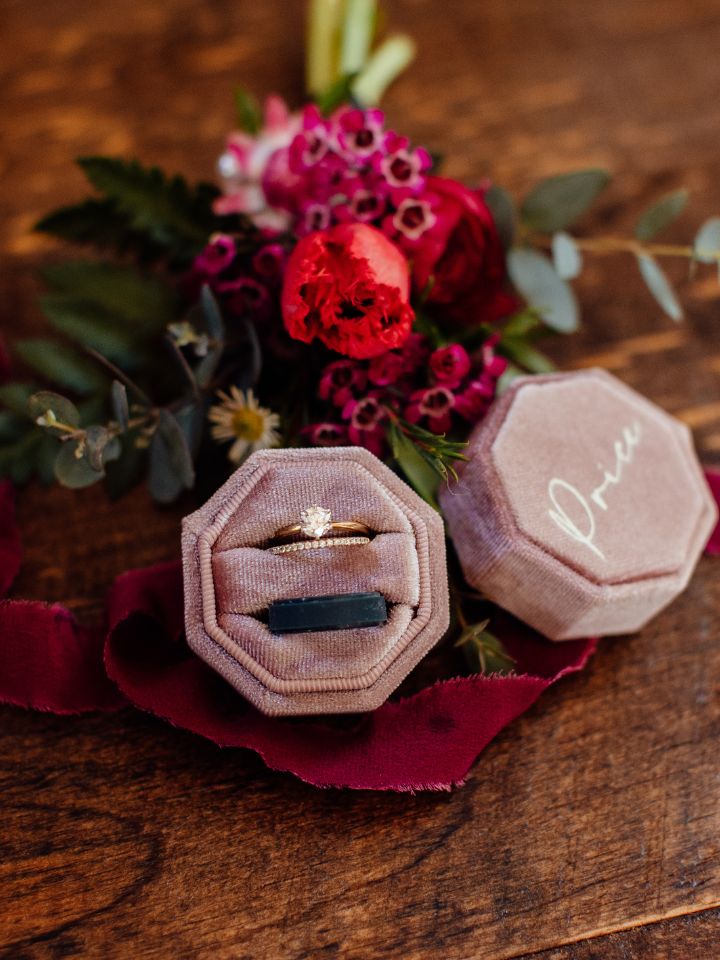 Pink velvet ring box with flowers.