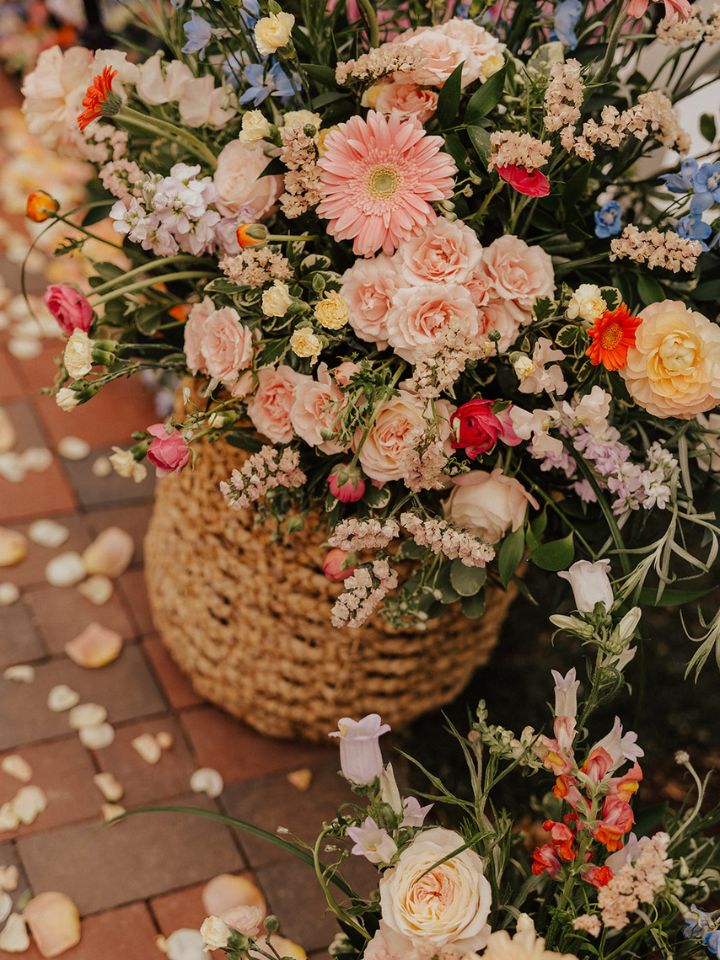 Closeup of large flower basket arrangements.