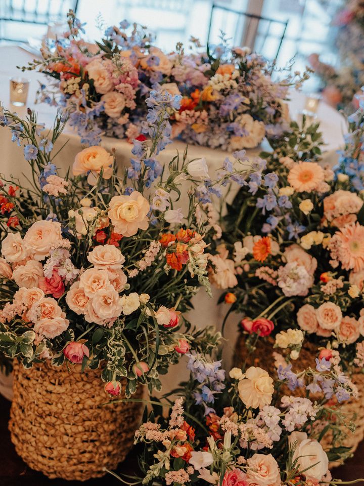 Closeup of flowers in basket arrangements.