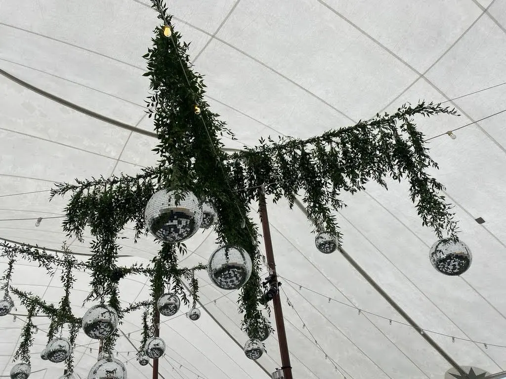 Greenery tent installation featured in the Wedding Chicks