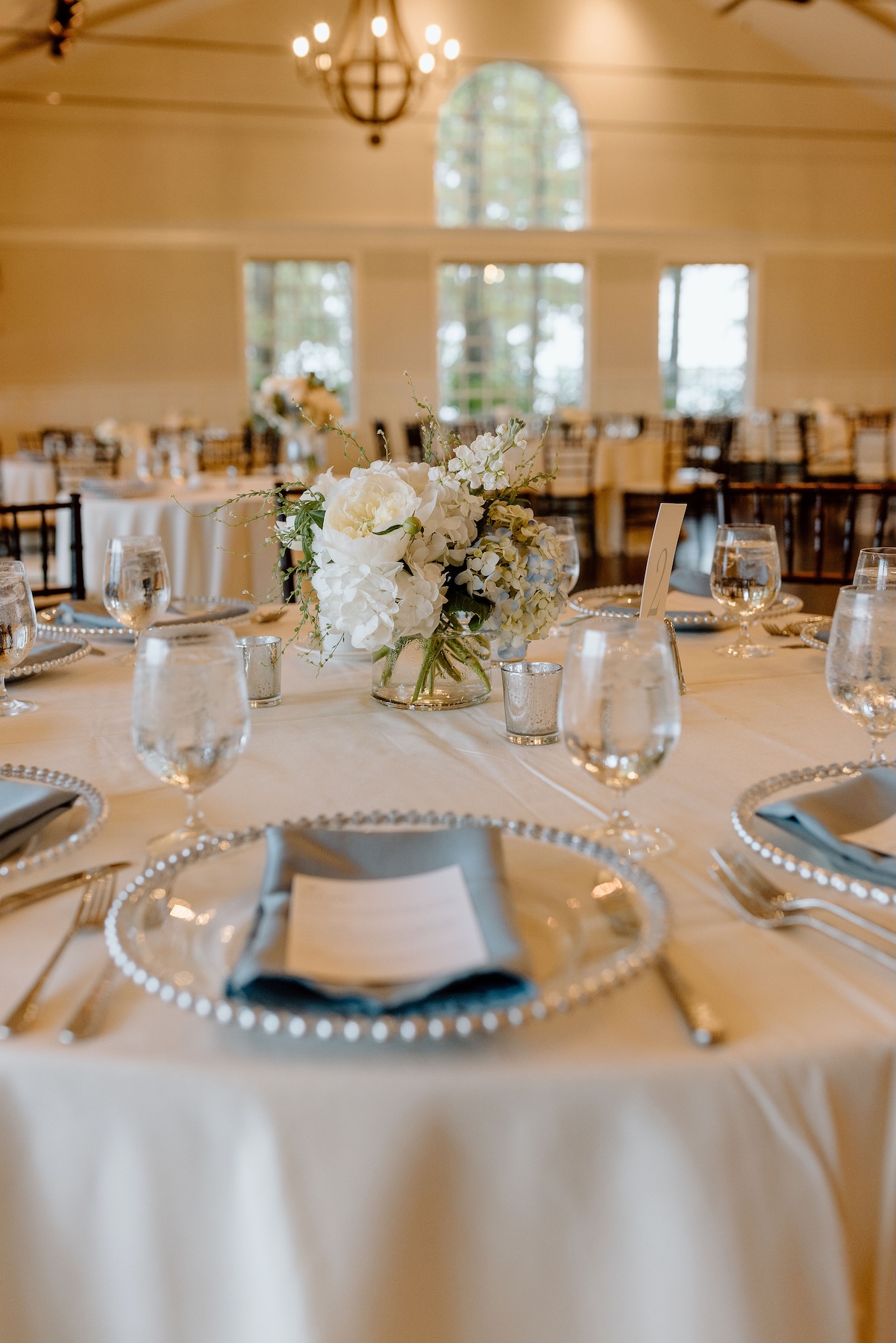 round-table-arrangement Round table arrangement in neutral florals by Wildly Native Flower Farm